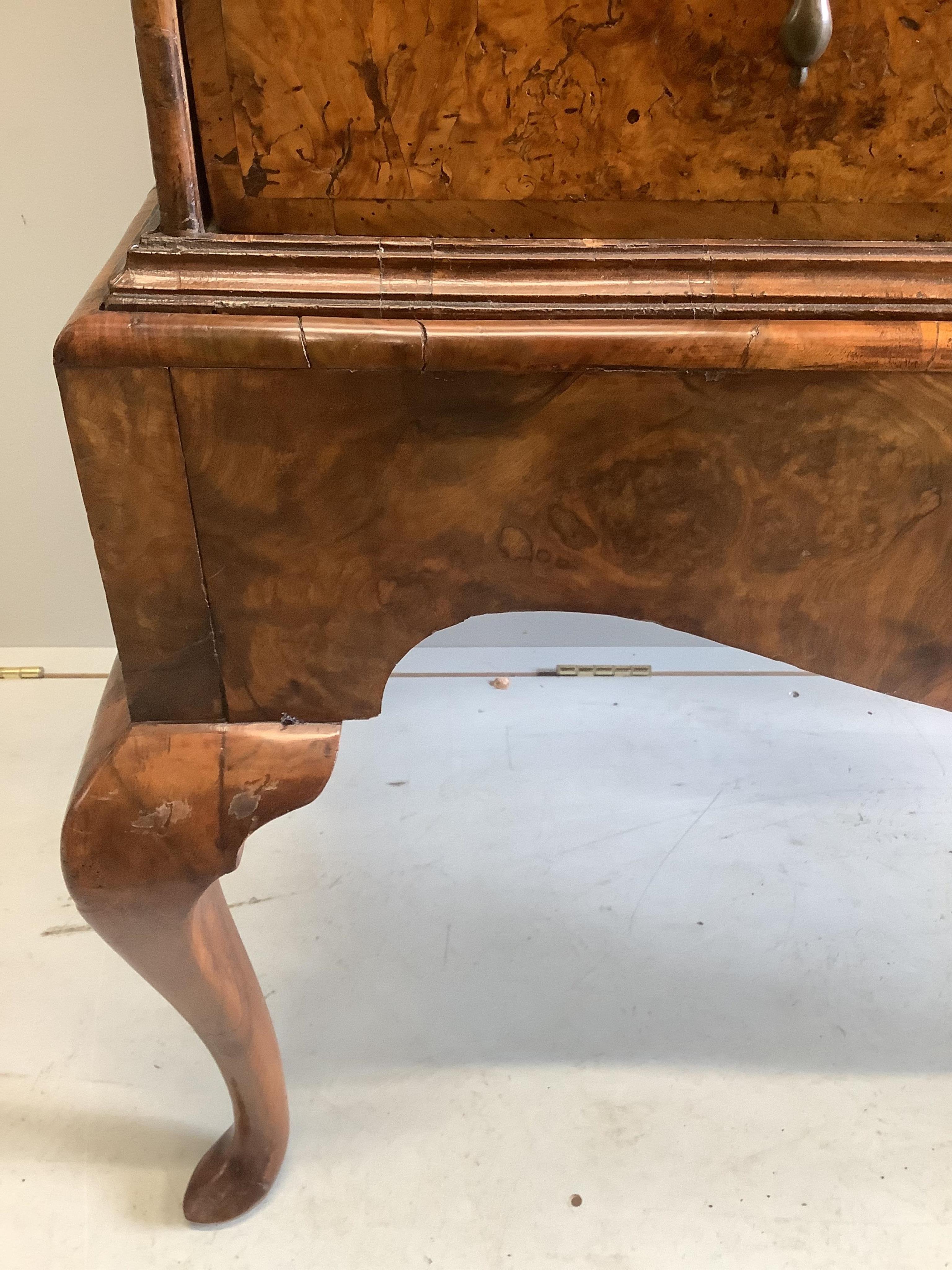 An early 18th century walnut chest on stand, width 98cm, depth 53cm, height 148cm. Condition - fair to good